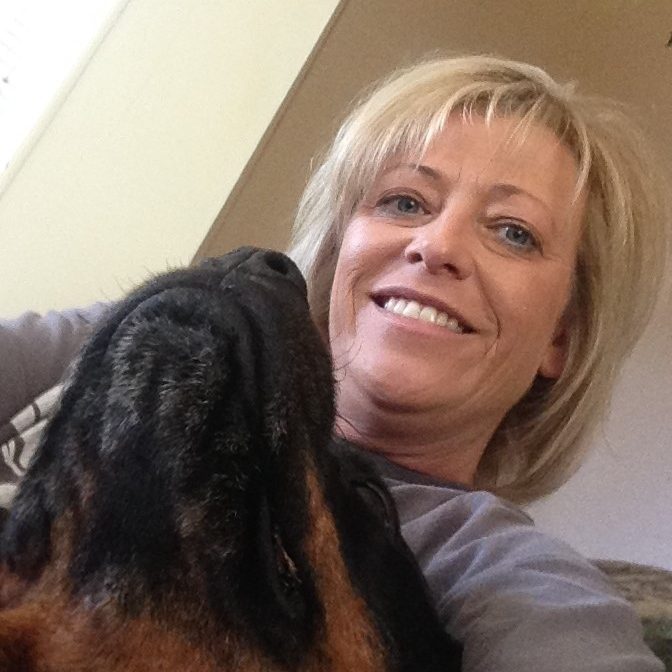 Colleen White, owner, with one of the boarding dogs